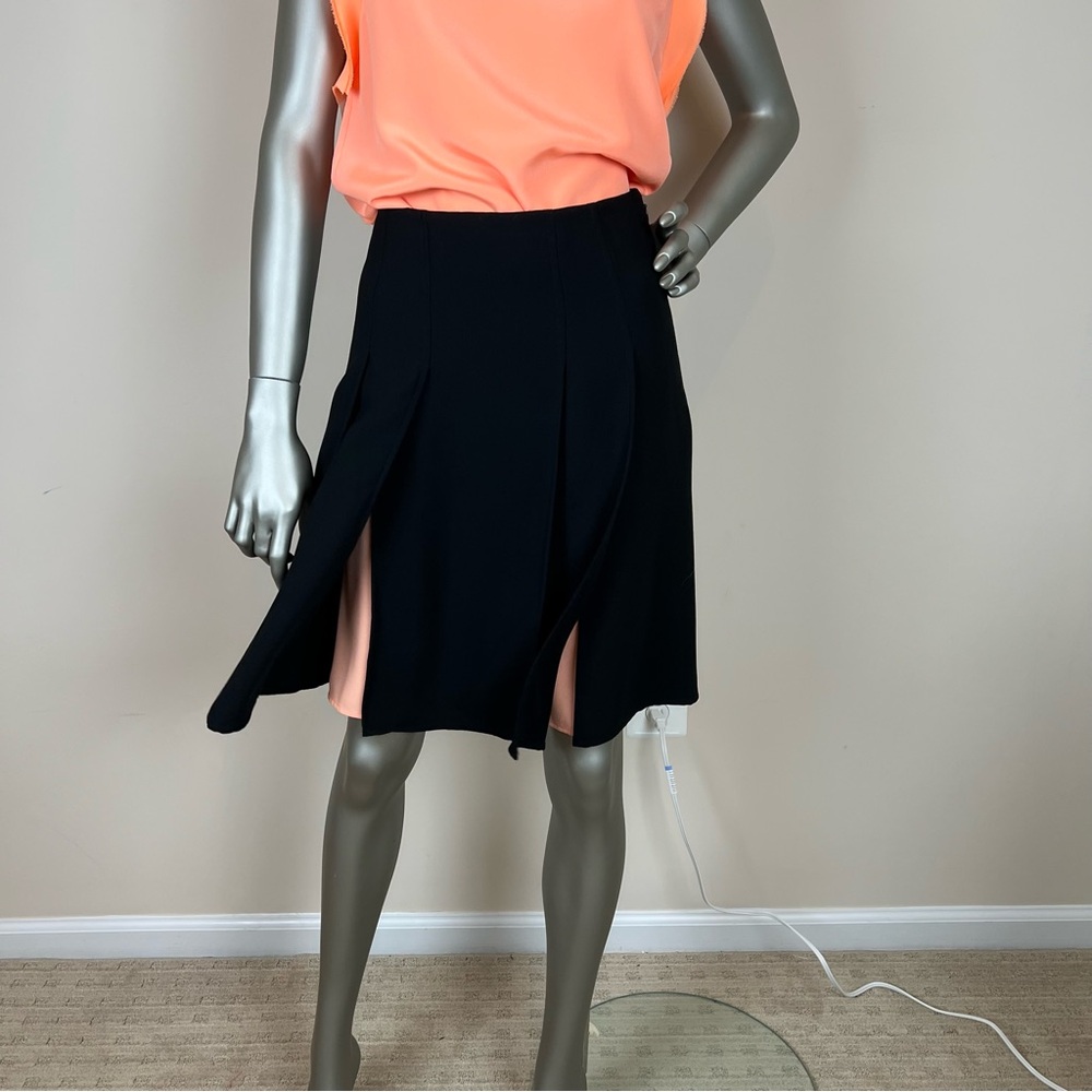 Ted Baker black slit pleated skirt w/orange lining. Swishy, classy. Ted 0, US 2
